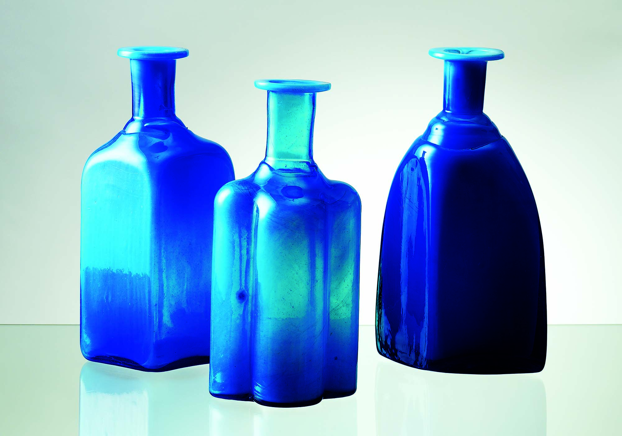 Three blue vases